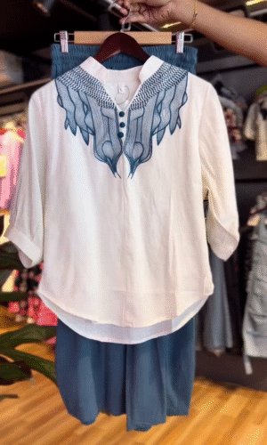 Two-Piece Set Featuring a Relaxed-Fit Blue Button-Detail Palazzo Pant and Embroidered White Half-Sleeve Top with Mandarin Collar Perfect for Casual Chic and Comfortable Style