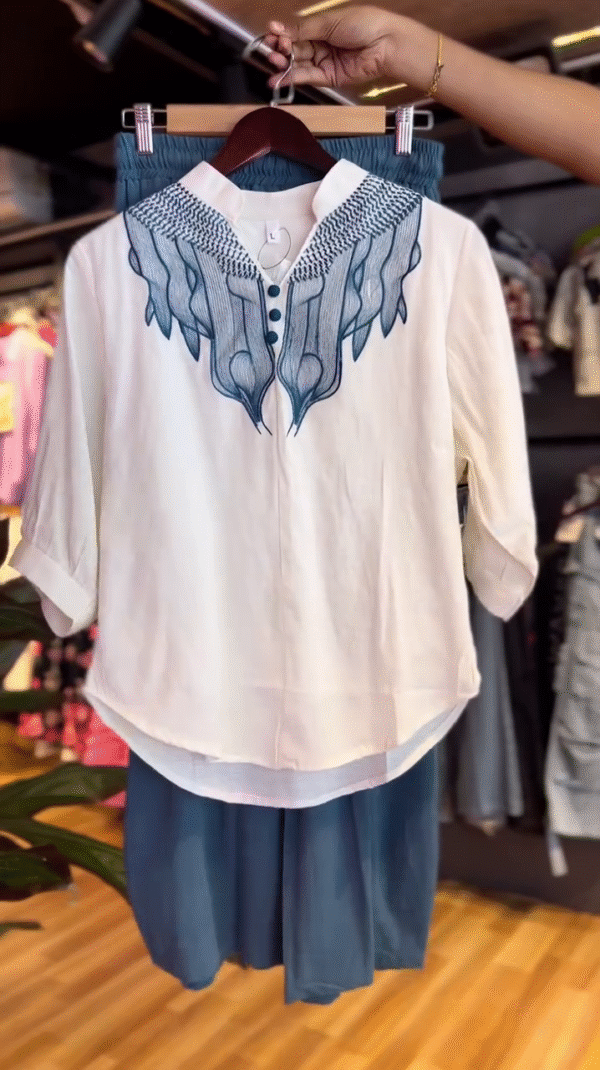 Two-Piece Set Featuring a Relaxed-Fit Blue Button-Detail Palazzo Pant and Embroidered White Half-Sleeve Top with Mandarin Collar Perfect for Casual Chic and Comfortable Style