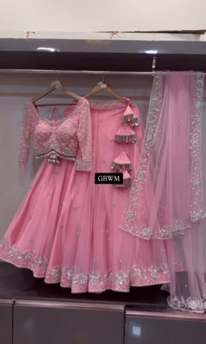 Baby Pink Designer Lehenga Choli Set with Sequined Net Blouse, Delicate Mirror and Thread Embellishments, Tassel Accents, and Matching Sheer Dupatta Featuring Intricate Floral Border Work – Perfect for Weddings, Receptions, and Festive Occasions