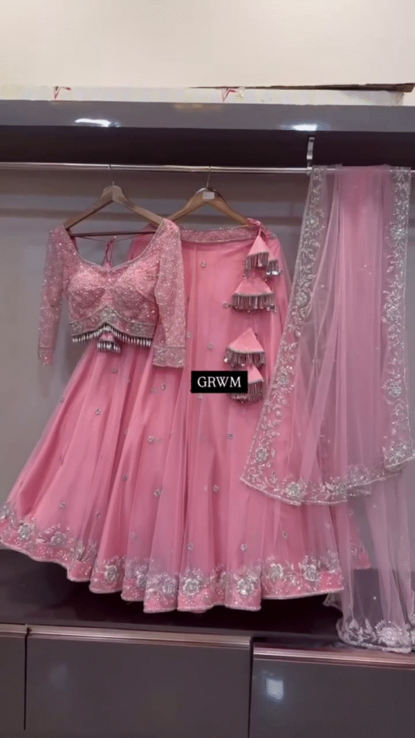 Baby Pink Designer Lehenga Choli Set with Sequined Net Blouse, Delicate Mirror and Thread Embellishments, Tassel Accents, and Matching Sheer Dupatta Featuring Intricate Floral Border Work – Perfect for Weddings, Receptions, and Festive Occasions